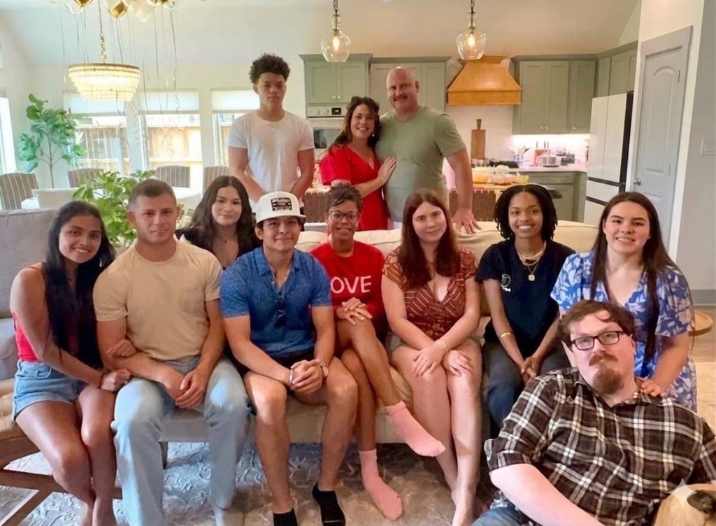 Janell Peterson with family in a bright living room and kitchen